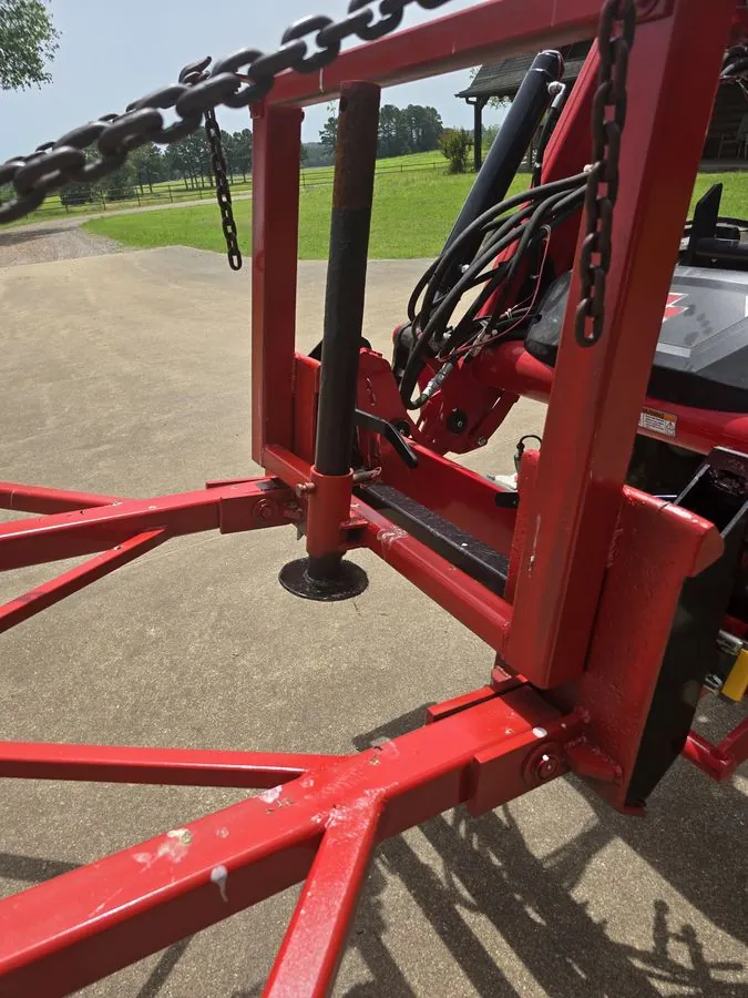 Red tilting gantry and heavy chain system on the SkidWick applicator