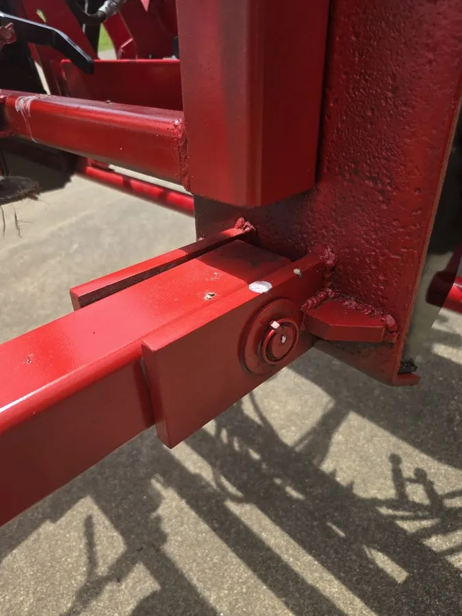 Heavy-duty pivot hinge assembly at the base of the SkidWick attachment